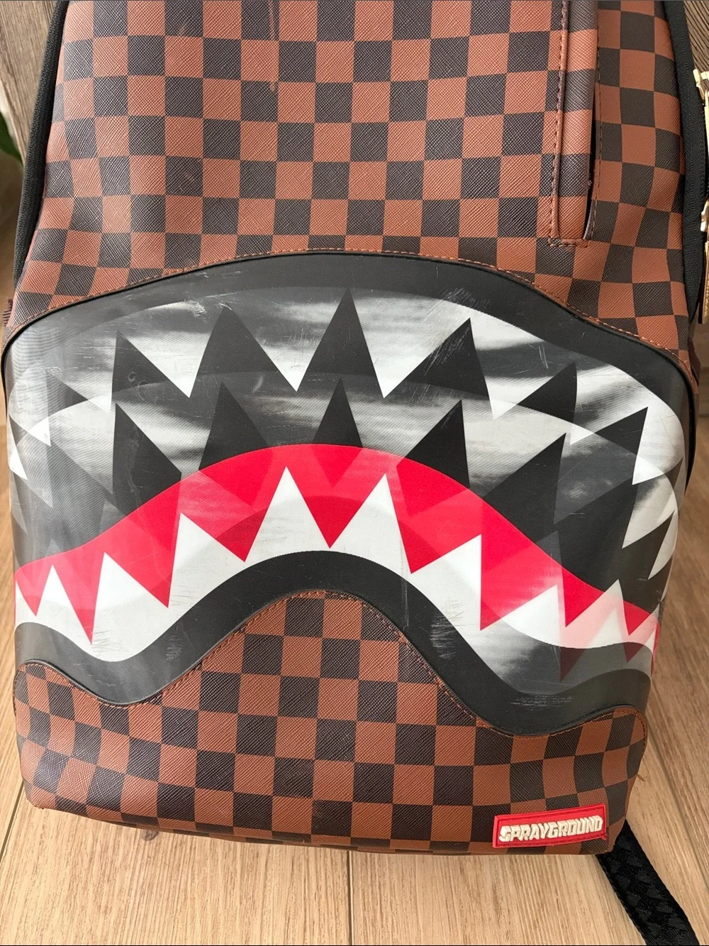 Sprayground Brown Checkerboard Backpack with Red & White Shark Mouth